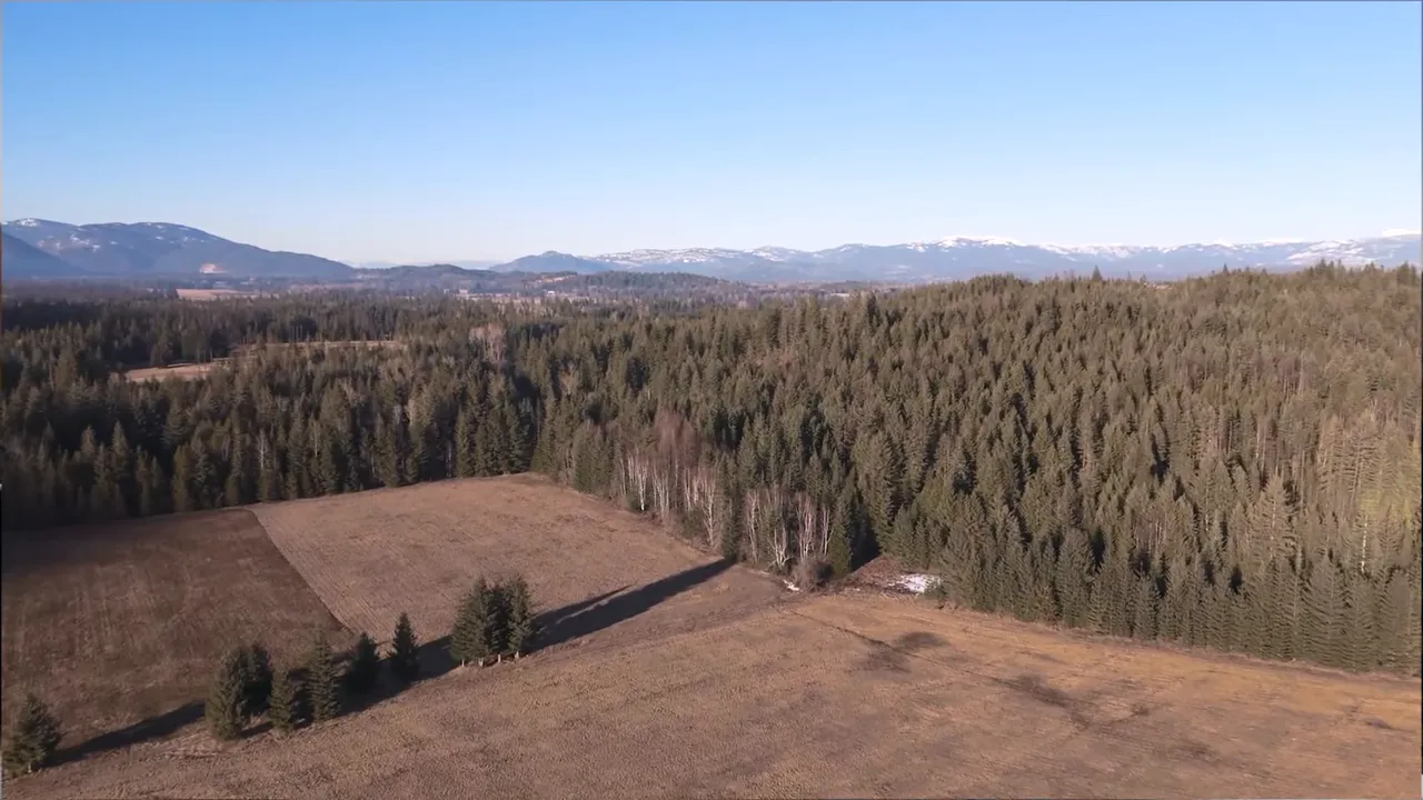 Aerial landscape with on screen checklist for fire mitigation weeds roads and fences