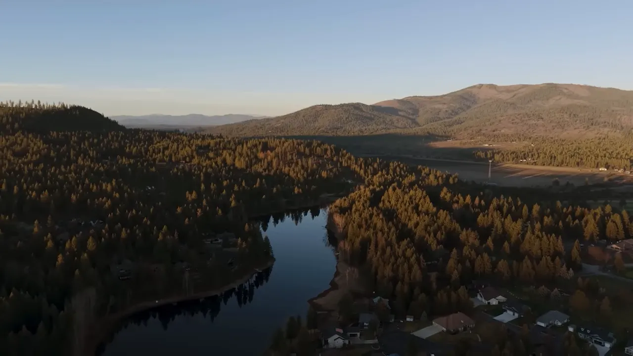 aerial view of forested hills and water near Blanchard at sunset