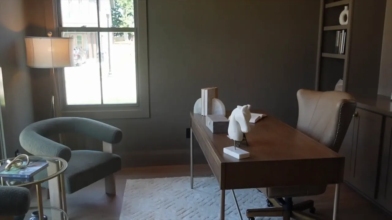 Office with dark walls desk chair large window and ceiling light