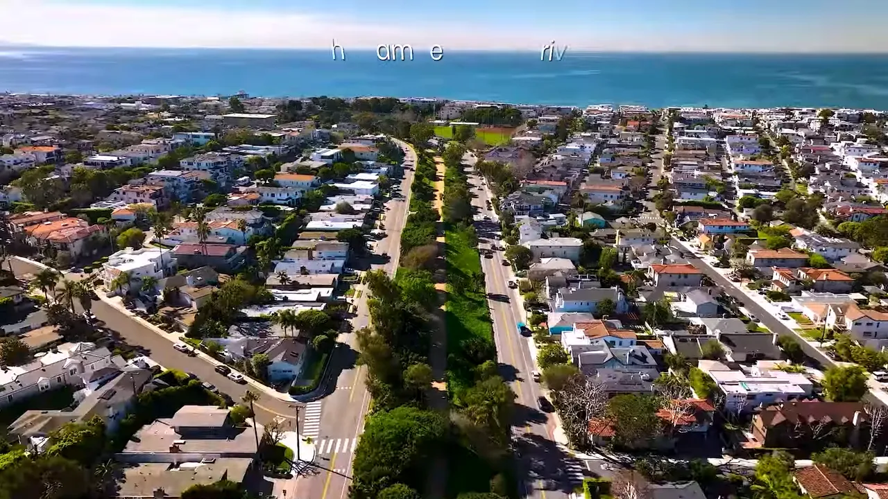 Aerial neighborhood near the coast with text about budget and line items