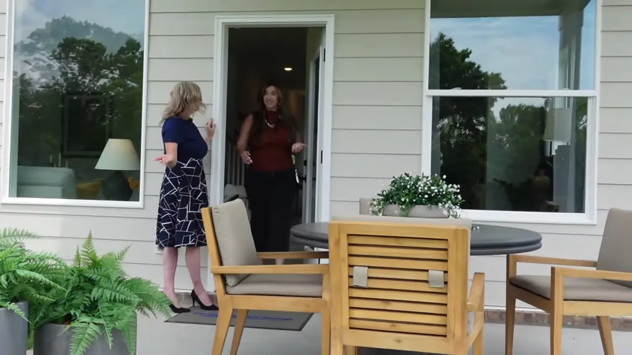 Covered back patio with outdoor dining set outside the rear door