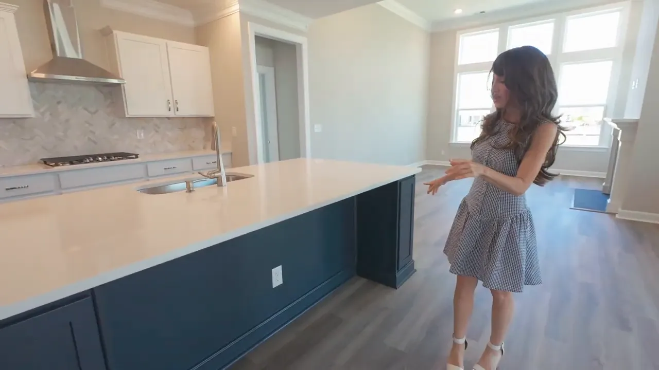 Blue kitchen island with built in wine rack at the end