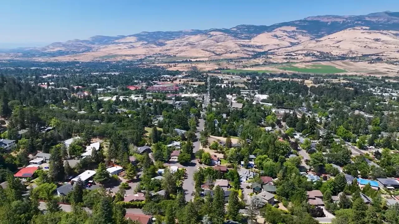 Presenter on a couch with a bold on-screen 'OCTOBER' graphic, illustrating Q4 timing and market context.