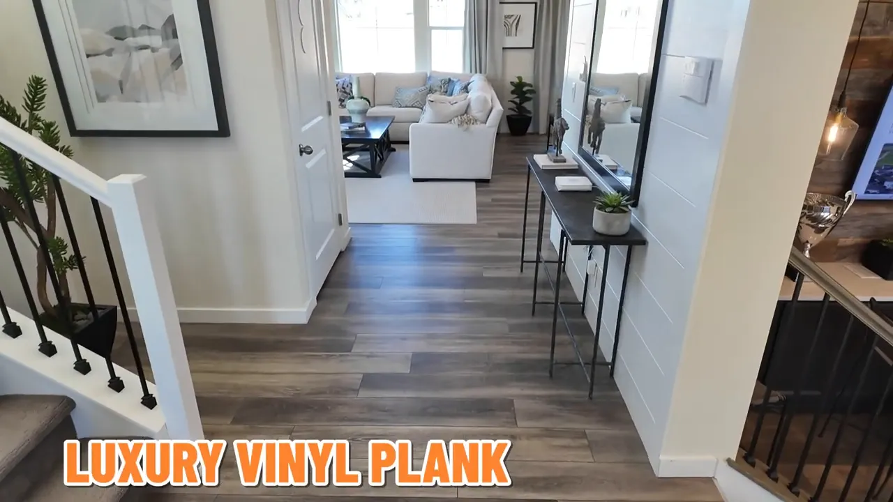 Powder room interior with toilet, modern flooring, and vanity in a new construction home in Independence subdivision near Elizabeth, Colorado