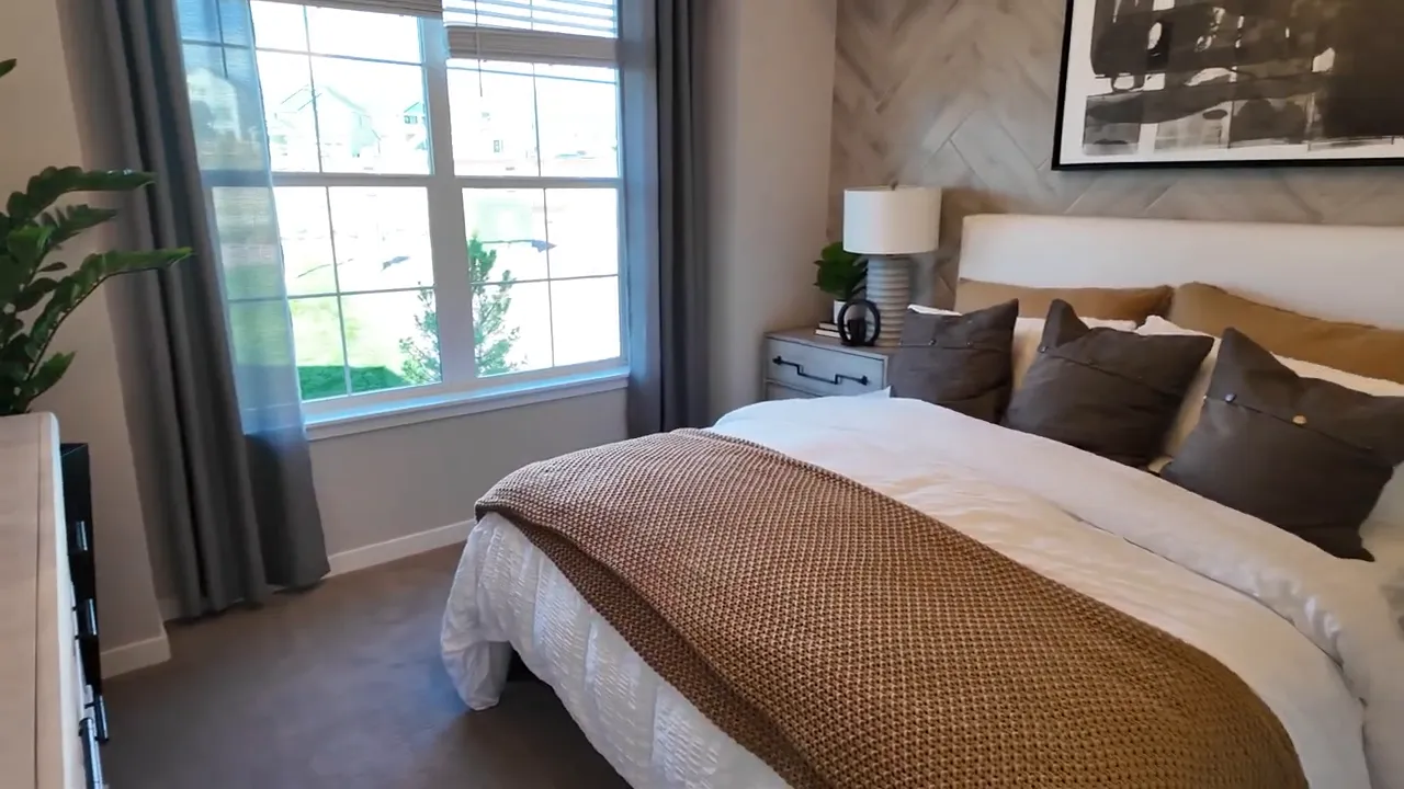 Bedroom interior with window seating and decor inside the Lennar Snowmass model in Independence subdivision, Elizabeth Colorado