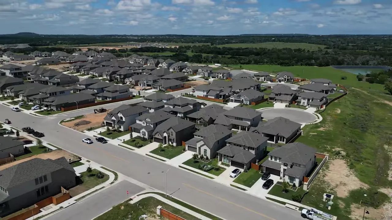 Aerial view of neighborhood with text showing 65 percent built out
