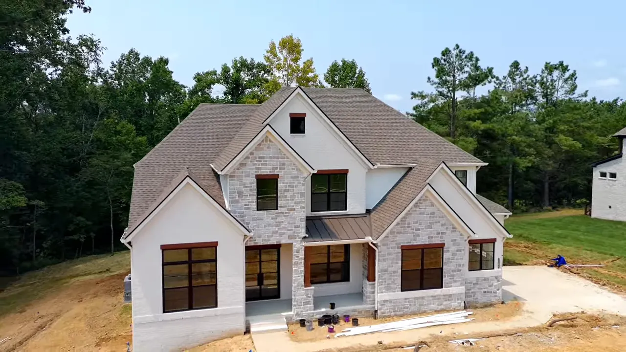 Aerial view of large homesites and completed homes in the neighborhood