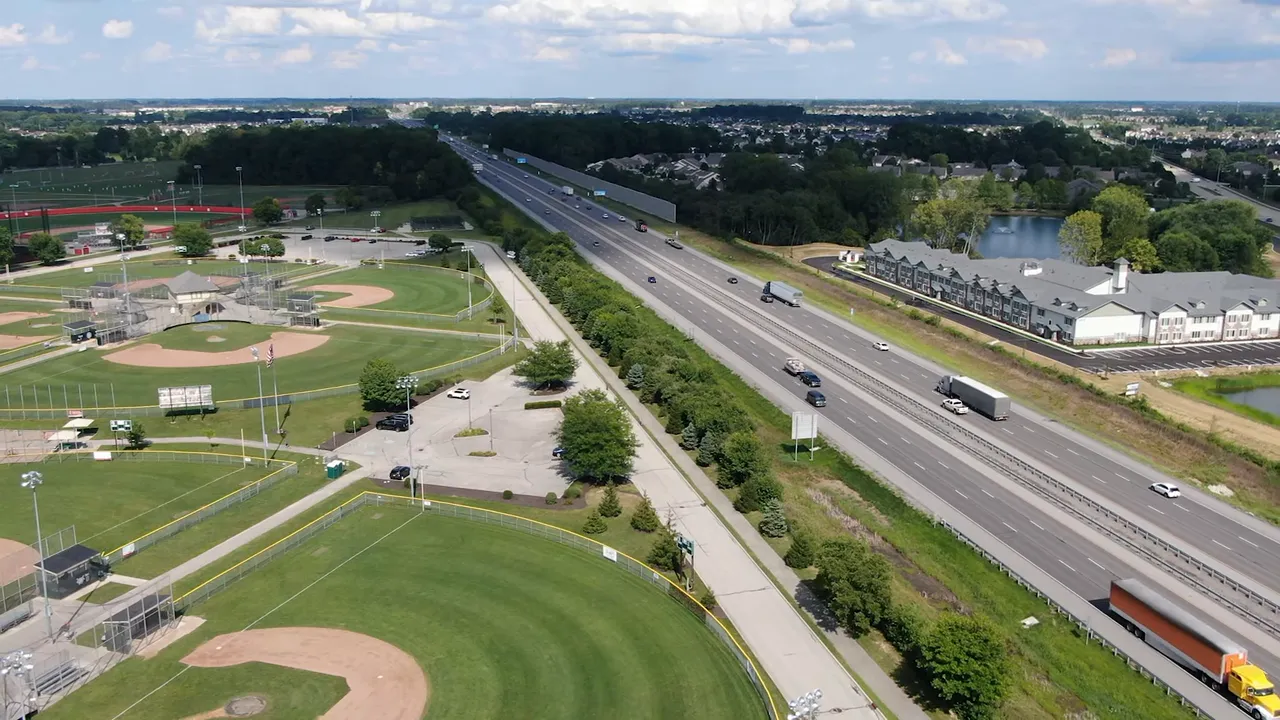 Aerial view of Fishers Nickel Plate District showing mixed‑use buildings, sidewalks, and streets.