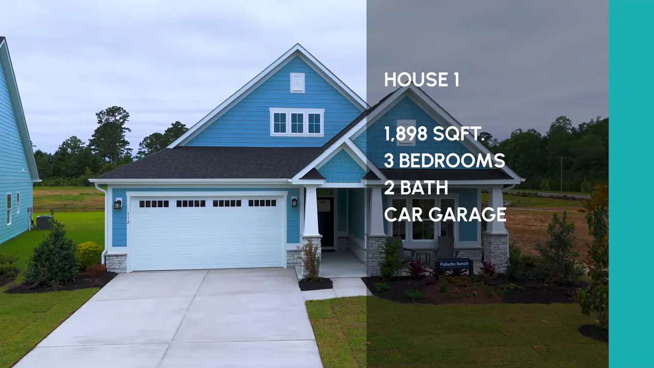 front exterior of blue hardie plank home with wide driveway and covered porch