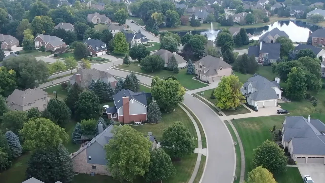 Historic home's porch and stone foundation with arched supports, showing architectural details