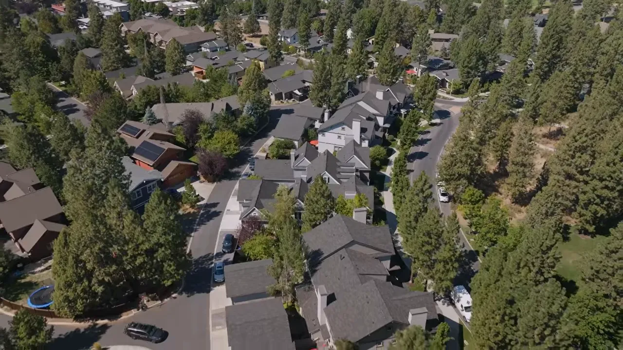 Exterior view of a modern new construction home with landscaping in Discovery West, Bend Oregon