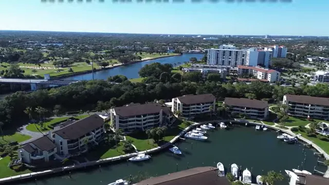 Aerial view of marina and waterfront residences with text noting many homes have private dockage