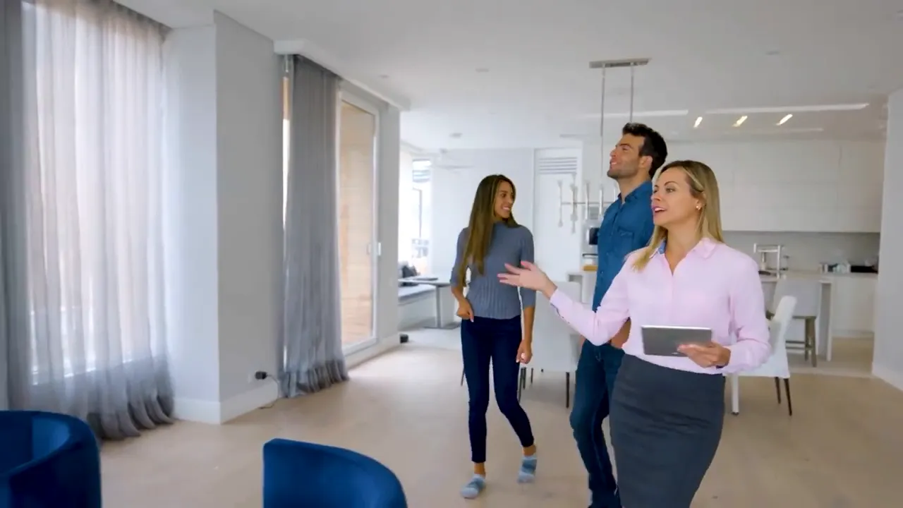 Agent walking buyers through a bright home with text reading final walkthrough