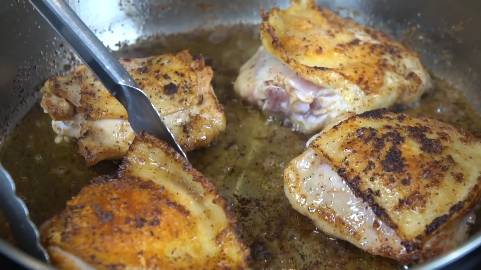 Flipping chicken thighs
