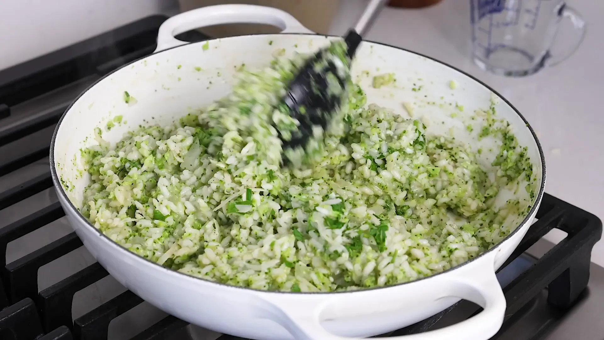 Cream being added to risotto