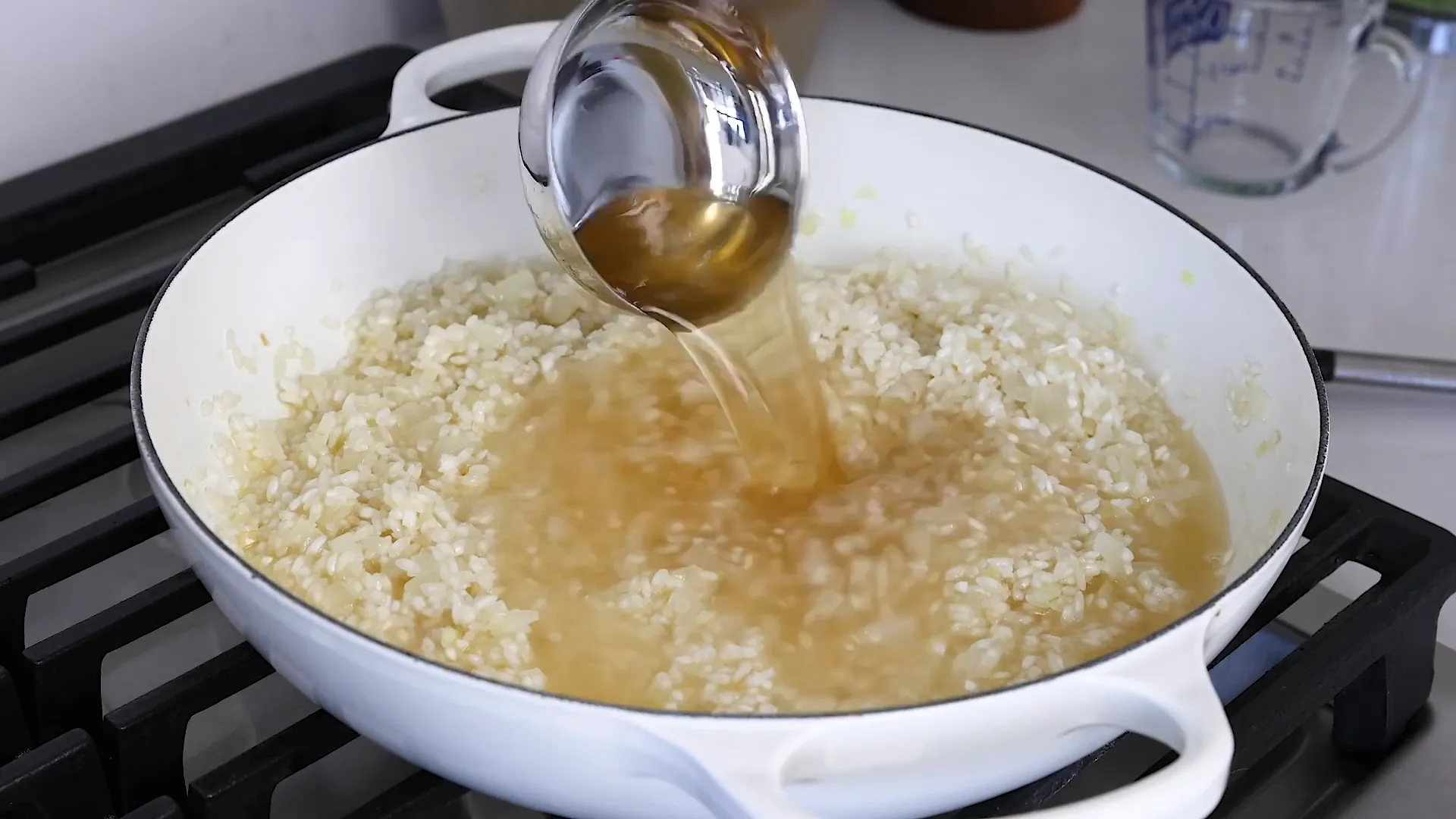 Adding broth to rice