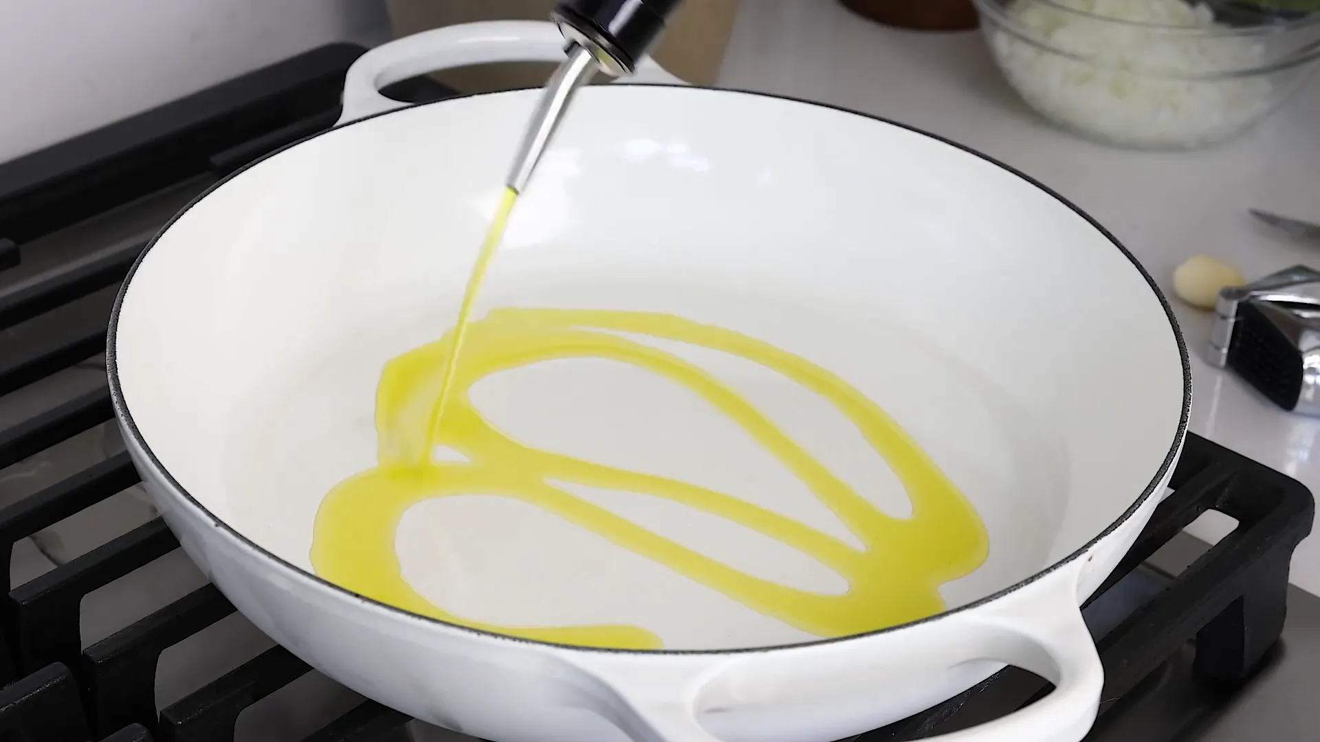 Adding olive oil to pan