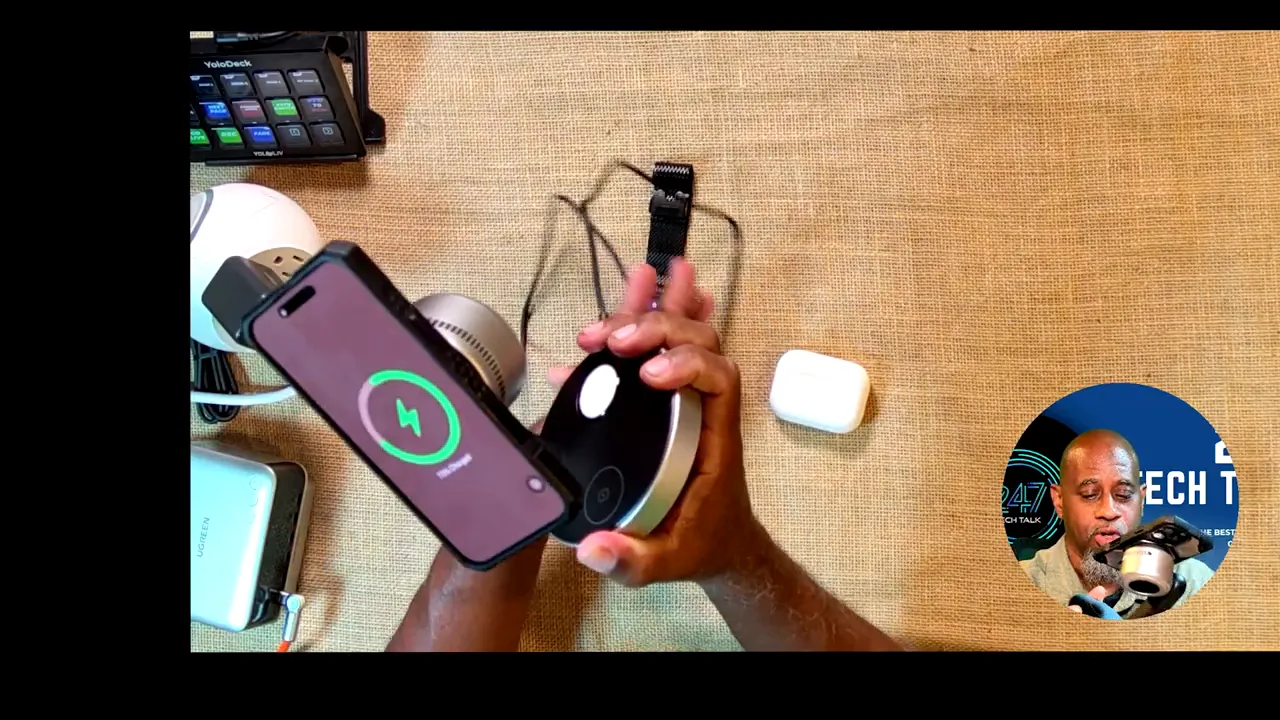 iPhone magnetically attached to charging stand with Apple Watch and AirPods charging nearby
