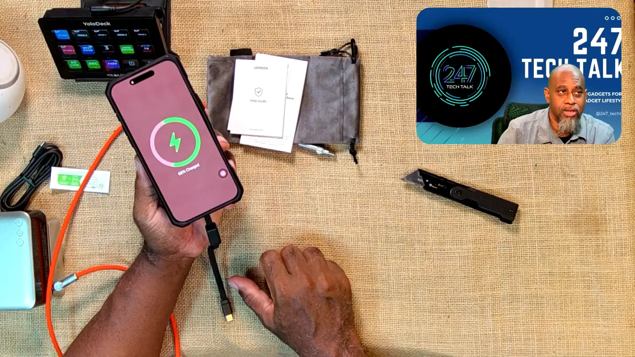 Phone held against the magnetic power bank with a green charging symbol visible on the phone screen