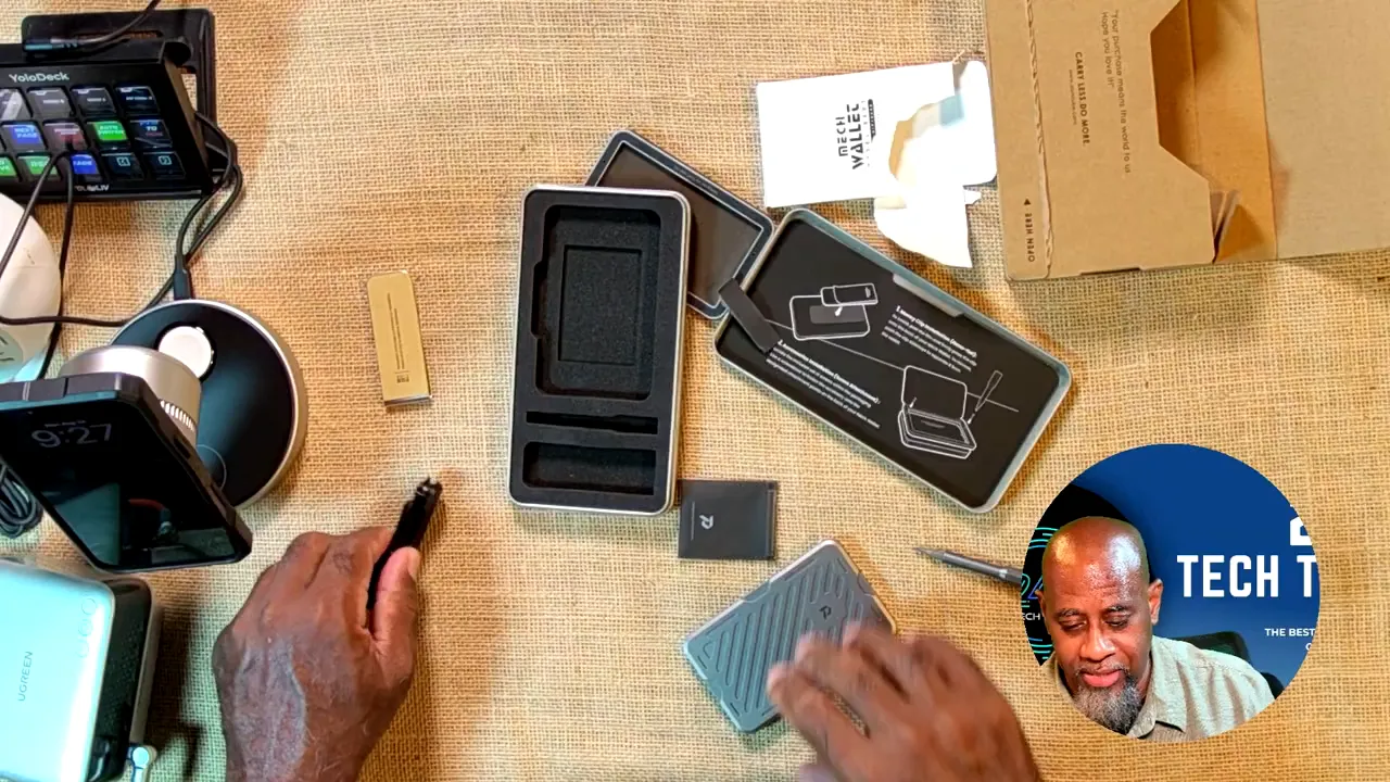 Wallet parts, screws, screwdriver, packaging tray, and instruction card on a desk
