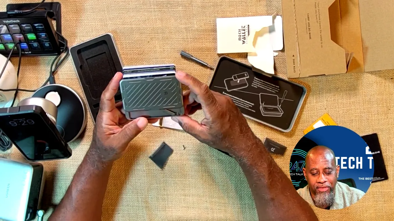 Several cards fanned out from the top of the metal wallet