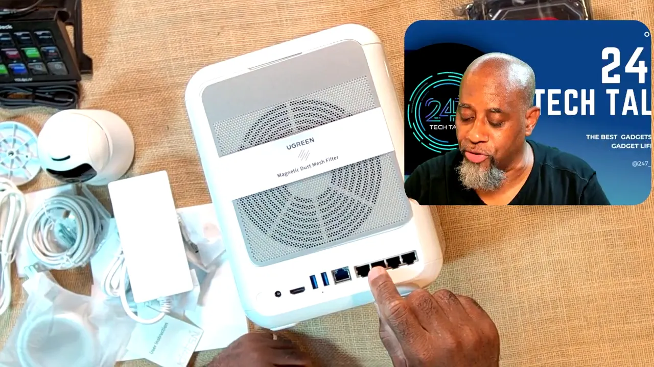 Underside of white HomeAgent hub with large fan filter and a row of connection ports