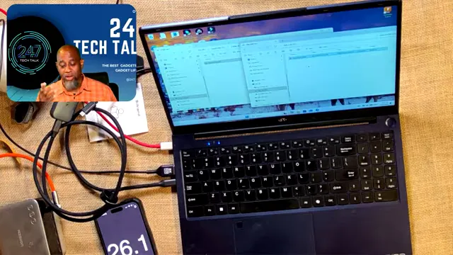 Laptop file transfer windows with a phone stopwatch showing 26.1 seconds