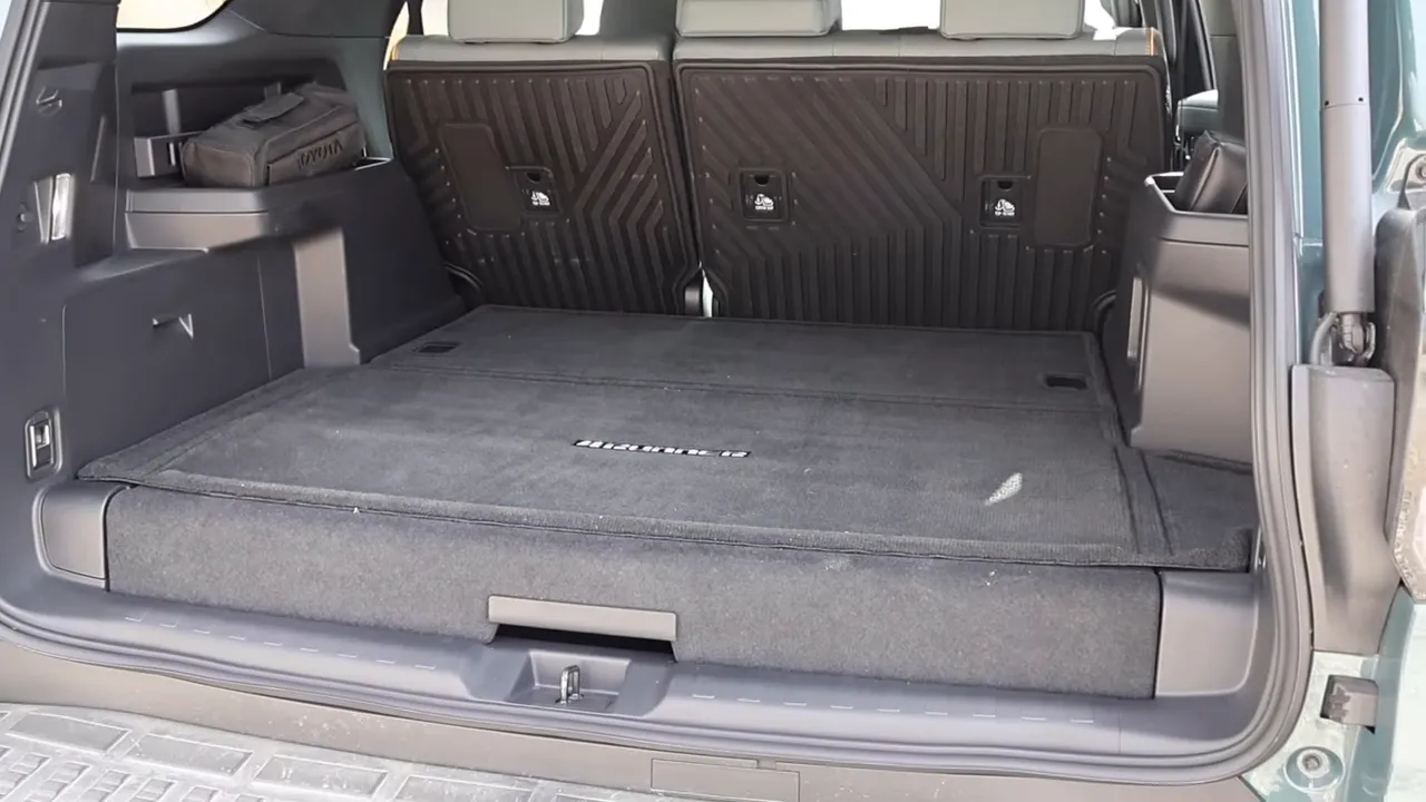 Rear cargo area of the Toyota 4Runner Trailhunter showing the raised cargo floor and rear seats that don't fold fully flat