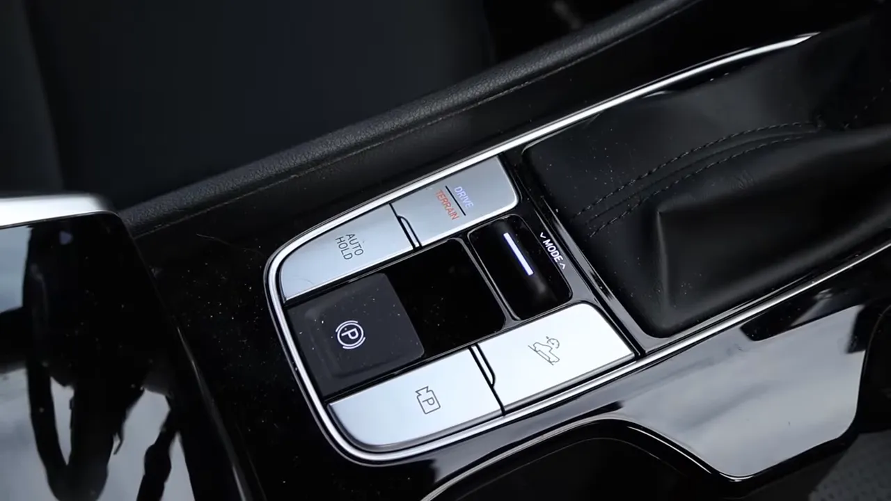 Hyundai Santa Cruz center console showing terrain drive mode buttons and electronic parking brake