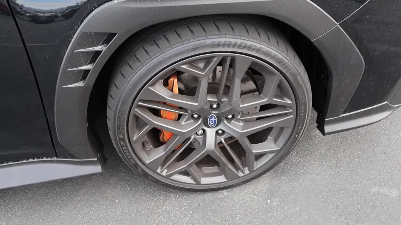 WRX TS 19-inch wheel and orange brake caliper close-up