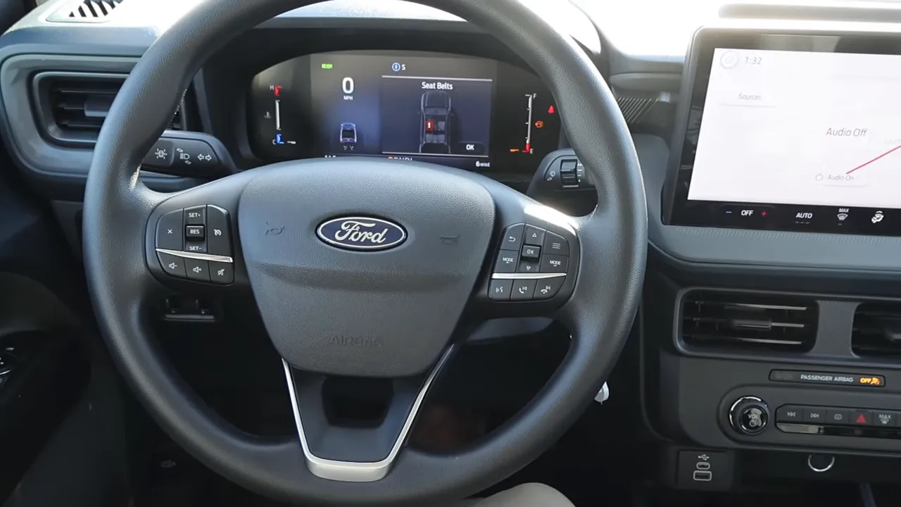 Ford Maverick interior showing steering wheel, dashboard and touchscreen, clear and uncluttered