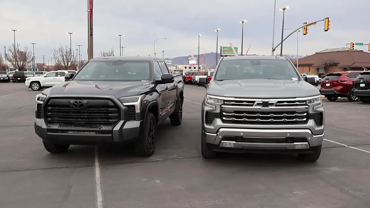 2026 Toyota Tundra and 2026 Chevrolet Silverado parked side-by-side showing front grilles and wheel stance