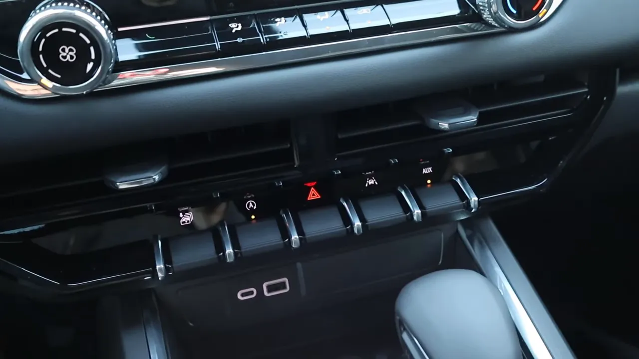 GMC Canyon center stack showing vents, toggle switches, USB ports and gear selector