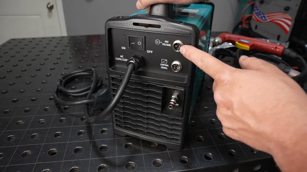 Finger pointing to 'Arc Voltage' port on the back of the BestArc BTC500XP