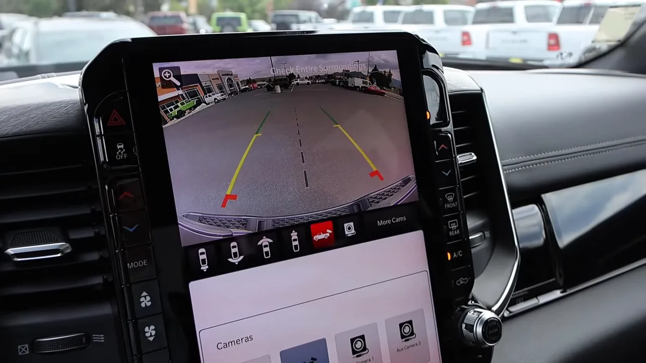 Ram center infotainment touchscreen showing rear camera view and parking guidelines