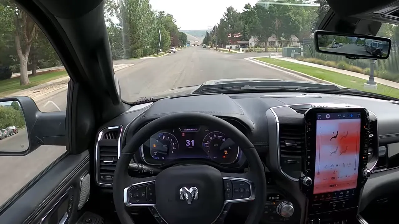 Ram 1500 driver POV with digital gauges showing 31 mph and center touchscreen