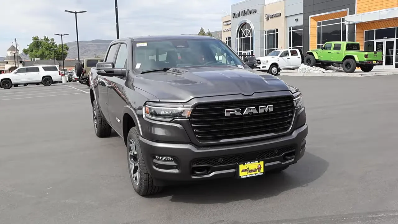 Front-facing view of Ram 1500 Laramie Sport showing grille and RAM lettering