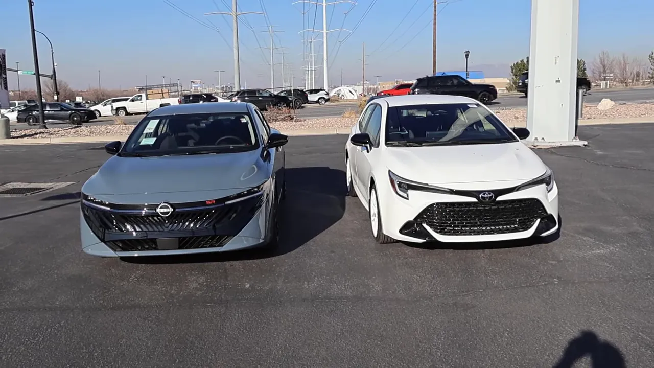 2026 Nissan Sentra parked next to 2026 Toyota Corolla front view for visual comparison