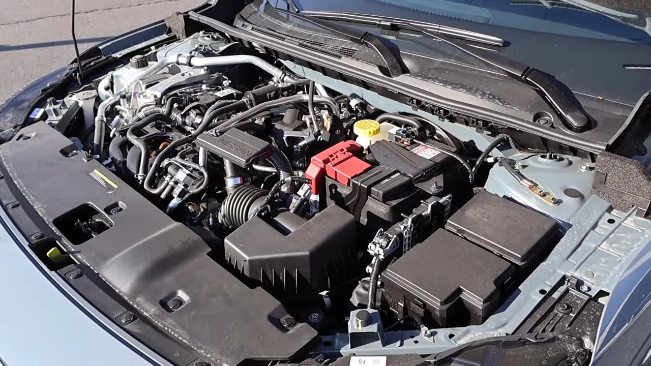 Wide, clear top-down view of a Nissan Sentra engine bay showing battery, airbox and intake with good lighting