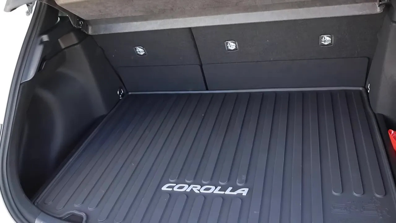 Toyota Corolla hatchback cargo area with Corolla-branded cargo mat