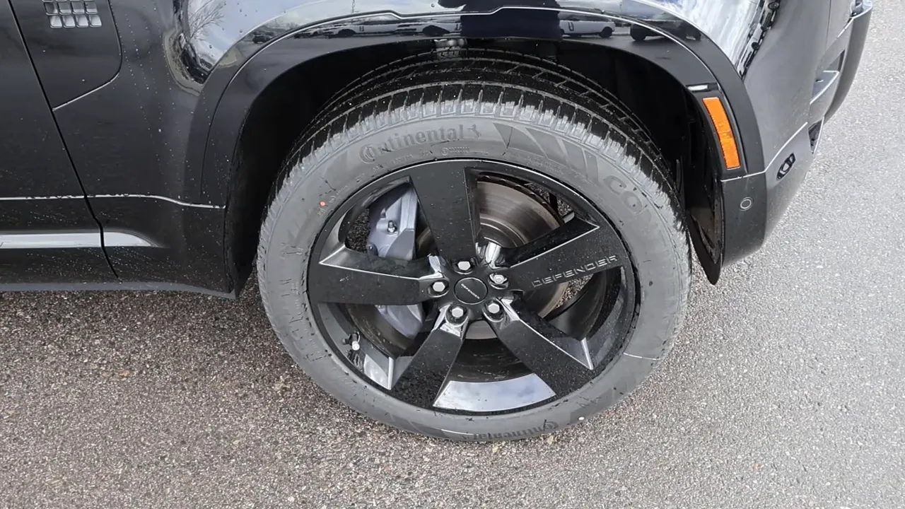 defender 22-inch black wheel continental tire close-up