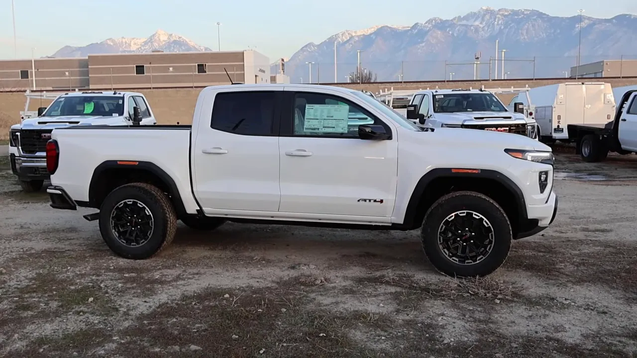 Side view of 2026 GMC Canyon AT4 showing fender flares, wheels and AT4 badge