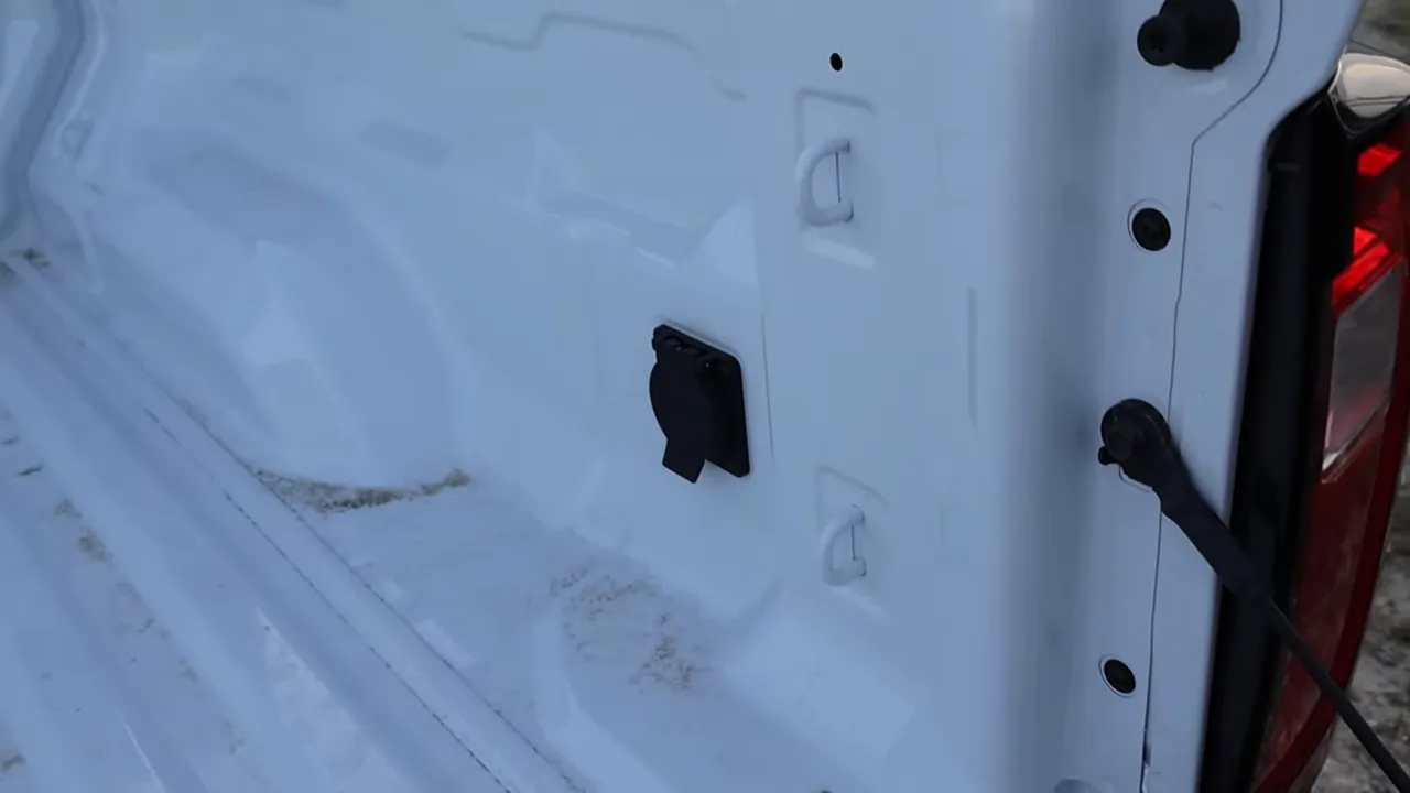 GMC Canyon truck bed interior showing a covered in-bed power outlet on the right side