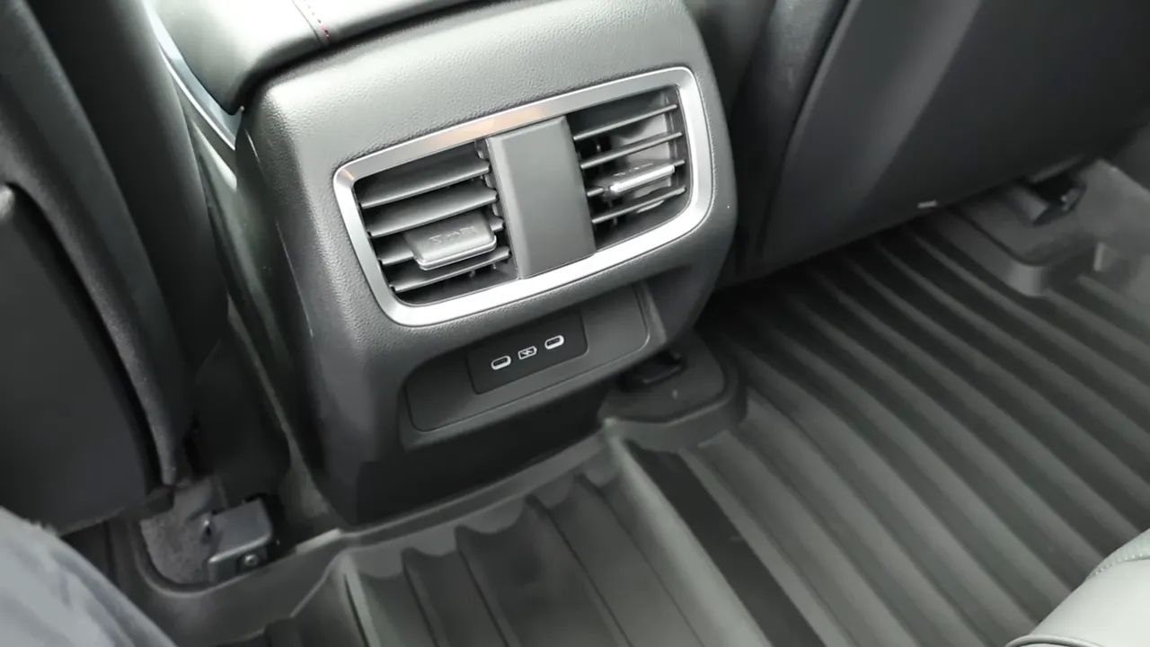 Rear center console air vents with dual USB ports and rubber floor mat