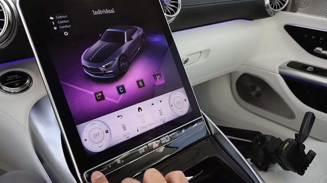 Portrait infotainment screen displaying 'Individual' drive mode with a vehicle graphic and climate controls below