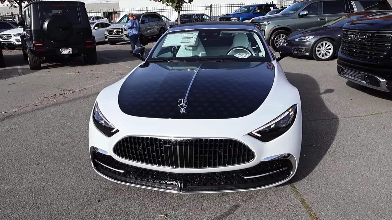 Front view of Maybach SL680 showing black hood with repeated monogram pattern, Mercedes star and grille