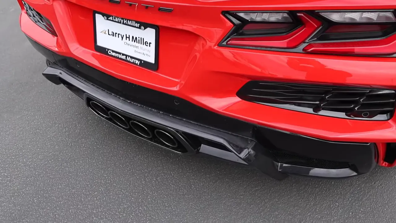 Close-up of the Corvette Z06 rear bumper showing the quad exhaust tips, diffuser and lower valance.