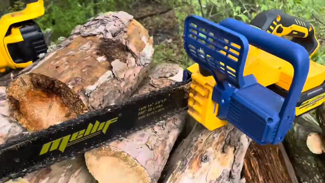Melli chainsaw bar next to a DeWalt battery on cut logs