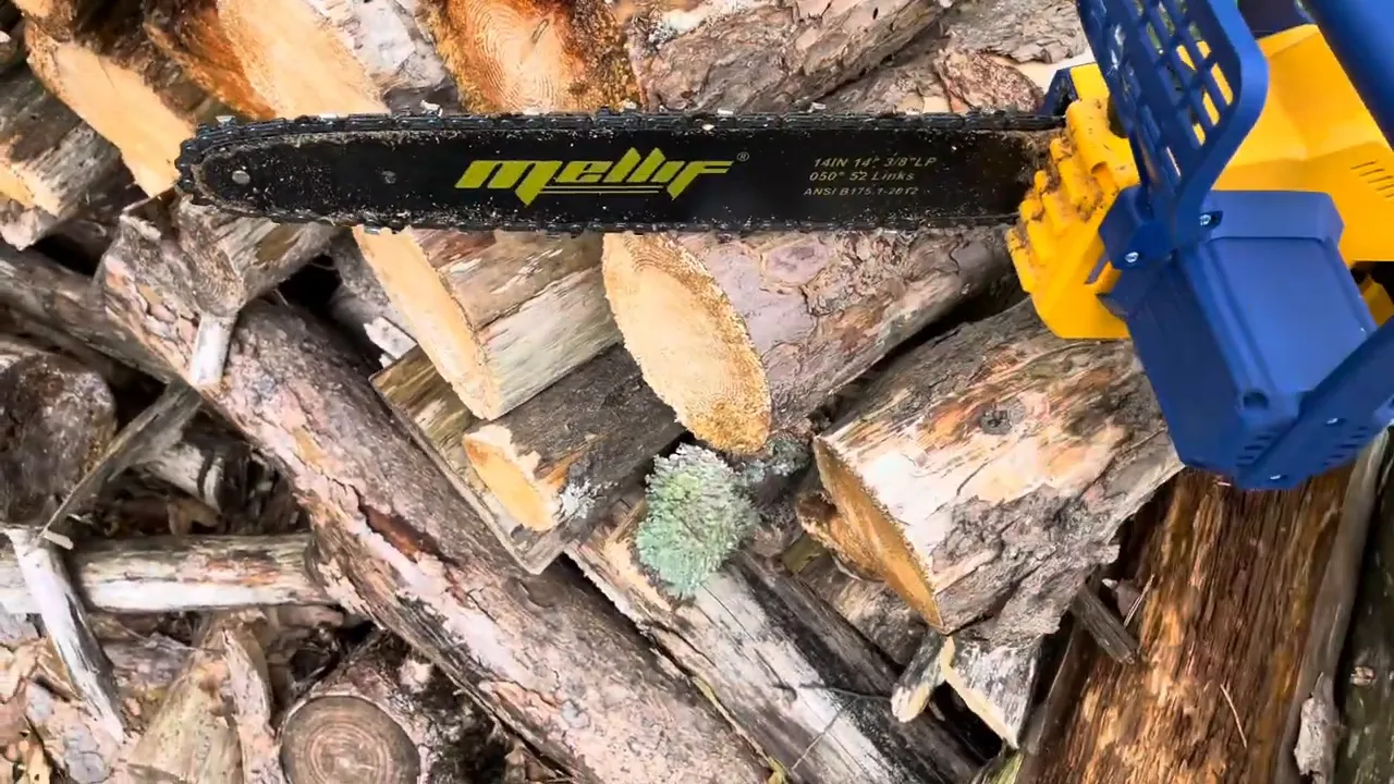 Melli 14-inch chainsaw bar and chain positioned over stacked logs