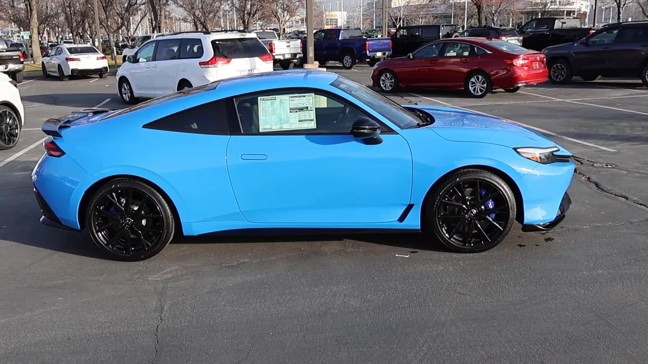 2026 Honda Prelude side view in Boost Blue highlighting silhouette, spoiler and wheel fitment